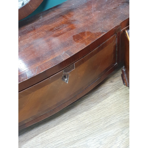 400 - A mahogany and satinwood serpentine Shield shaped Dressing Mirror with three fitted drawers raised o... 