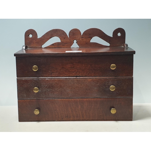 41 - A 19th Century Welsh oak Candle Box with pierced and shaped surmount, two dummy drawers and central ... 