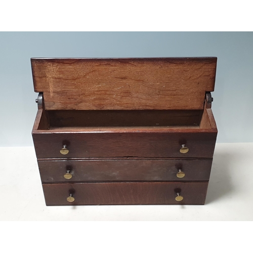 41 - A 19th Century Welsh oak Candle Box with pierced and shaped surmount, two dummy drawers and central ... 