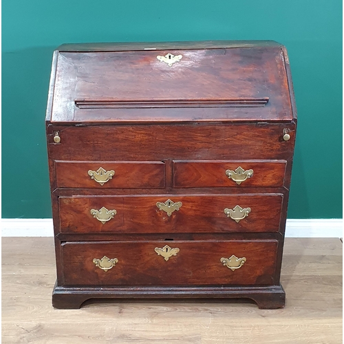 43 - An 18th Century elm Bureau, the interior fitted pigeon holes and drawers (one drawer missing) either... 