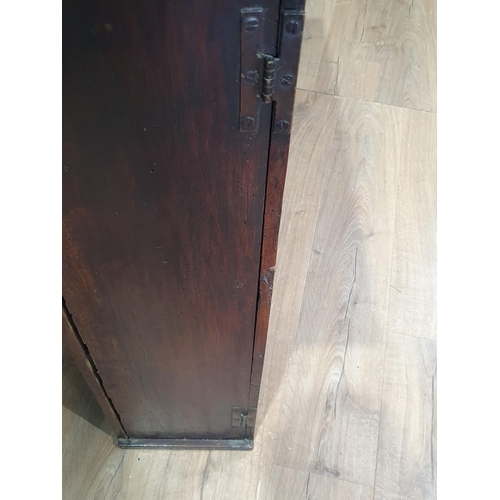 44 - An 18th Century fruitwood Cupboard with pair of fielded panelled doors enclosing an arrangement of a... 