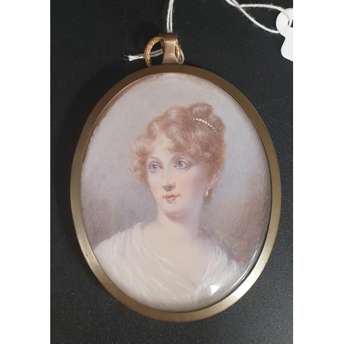 448 - ENGLISH SCHOOL.  Portrait miniature of a lady, head and shoulders, oval on ivory, 2 x 2 1/2in and tw... 