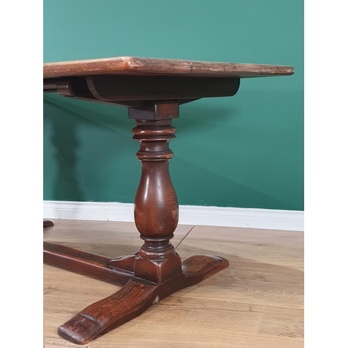 451 - An oak Refectory Table on turned supports united by central stretcher, 2ft 6