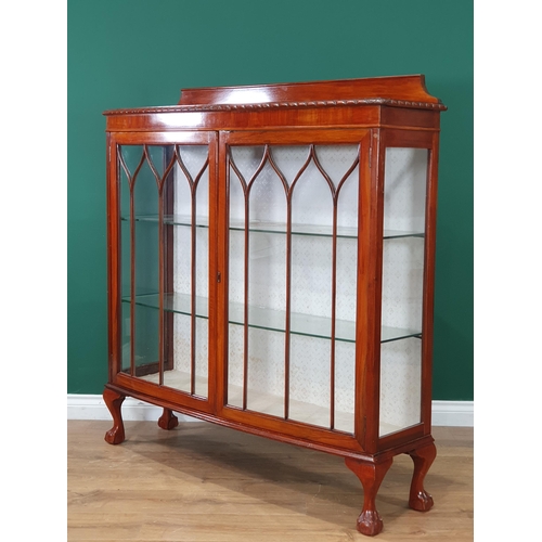 459 - A Mahogany Bow fronted display cabinet with raised back on claw and ball feet. 3ft 11