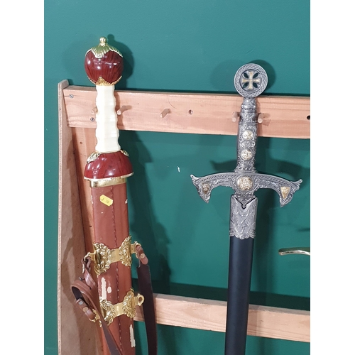 488 - A collection of various swords some in scabbards a dagger and a model of a rifle (stand not included... 