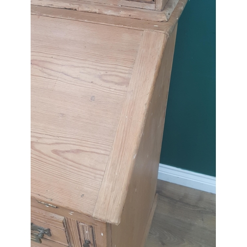 490 - A pitch pine Secretaire Bookcase, the top with open shelves and a pair of fitted drawers above the f... 