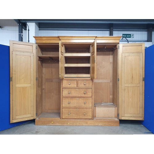 491 - A Victorian ash and satinwood Wardrobe with urn and swag inlay, fitted pair of mirror doors flanking... 