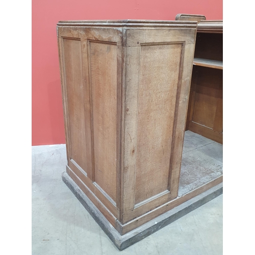 492 - An oak Church Pew & Lectern on plinth base, 4ft 3