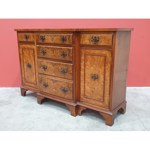 497 - A reproduction breakfront Sideboard/TV Stand with four central graduated drawers flanked by cupboard... 