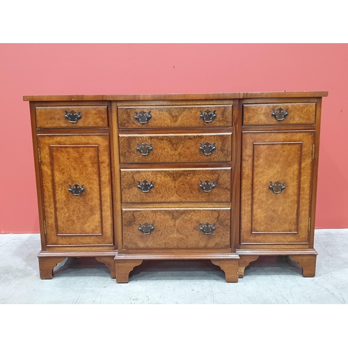 497 - A reproduction breakfront Sideboard/TV Stand with four central graduated drawers flanked by cupboard... 