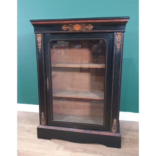 506 - A 19th Century ebonised and walnut veneered Music Cabinet fitted glazed door with gilded brass mount... 