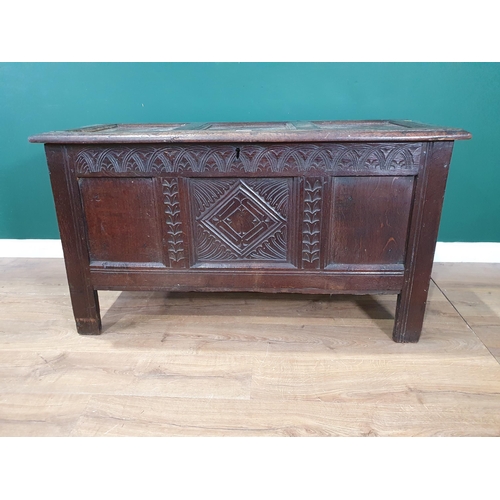 513 - A 17th Century oak Coffer with sunken three panel lid above carved frieze and three panel front 4ft ... 