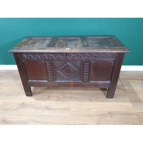 513 - A 17th Century oak Coffer with sunken three panel lid above carved frieze and three panel front 4ft ... 