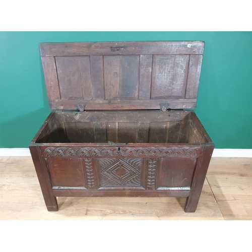 513 - A 17th Century oak Coffer with sunken three panel lid above carved frieze and three panel front 4ft ... 