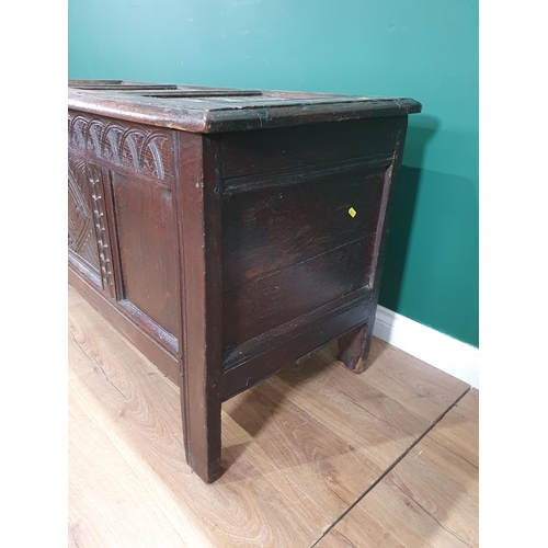 513 - A 17th Century oak Coffer with sunken three panel lid above carved frieze and three panel front 4ft ... 