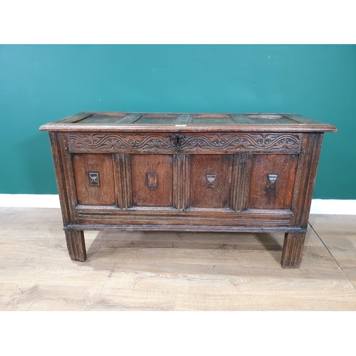 514 - A 17th Century joined oak Coffer with sunken four panel lid above plain four panel front with applie... 