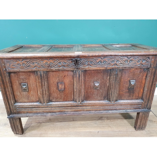 514 - A 17th Century joined oak Coffer with sunken four panel lid above plain four panel front with applie... 