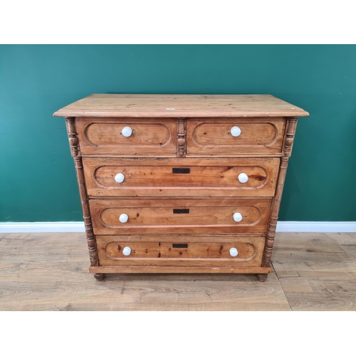 528 - A 19th Century Continental pine Chest of two short and three long drawers raised on turned supports ... 