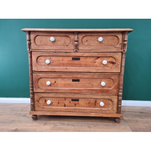 528 - A 19th Century Continental pine Chest of two short and three long drawers raised on turned supports ... 