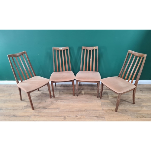 529 - A set of four teak G-Plan Dining Chairs with beige upholstered seats on square tapered supports, A/F... 