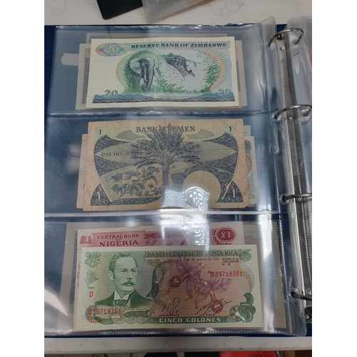 539 - An Album of world Banknotes, to include examples from Cyprus, China, Hong Kong, Norway, Japan etc. a... 