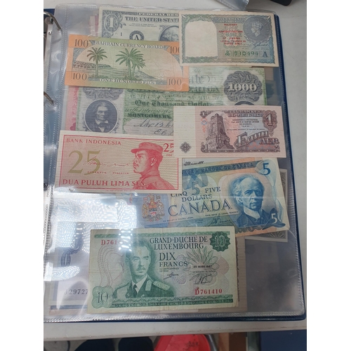 539 - An Album of world Banknotes, to include examples from Cyprus, China, Hong Kong, Norway, Japan etc. a... 