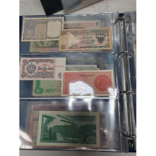 539 - An Album of world Banknotes, to include examples from Cyprus, China, Hong Kong, Norway, Japan etc. a... 