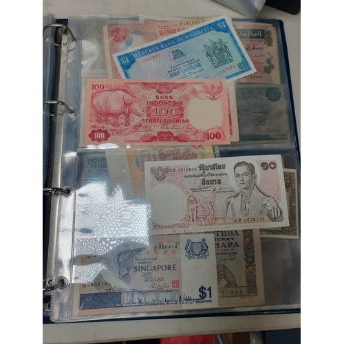 539 - An Album of world Banknotes, to include examples from Cyprus, China, Hong Kong, Norway, Japan etc. a... 