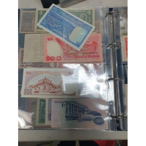 539 - An Album of world Banknotes, to include examples from Cyprus, China, Hong Kong, Norway, Japan etc. a... 