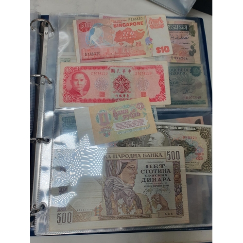 539 - An Album of world Banknotes, to include examples from Cyprus, China, Hong Kong, Norway, Japan etc. a... 