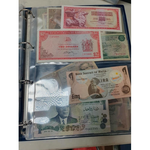 539 - An Album of world Banknotes, to include examples from Cyprus, China, Hong Kong, Norway, Japan etc. a... 