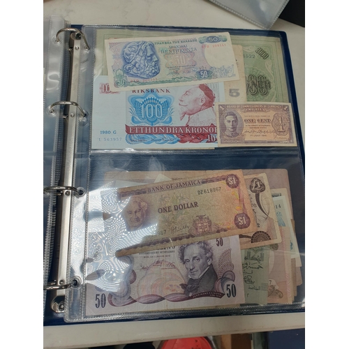 539 - An Album of world Banknotes, to include examples from Cyprus, China, Hong Kong, Norway, Japan etc. a... 