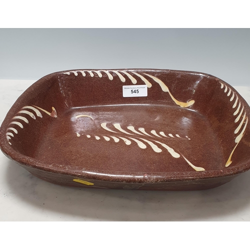 545 - A 19th Century English Slipware Baking Dish, with brown glaze and feathered white slip trail decorat... 