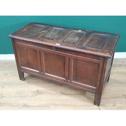 55 - A 17th century oak Coffer with four panel lid and plain three panel front, 4ft