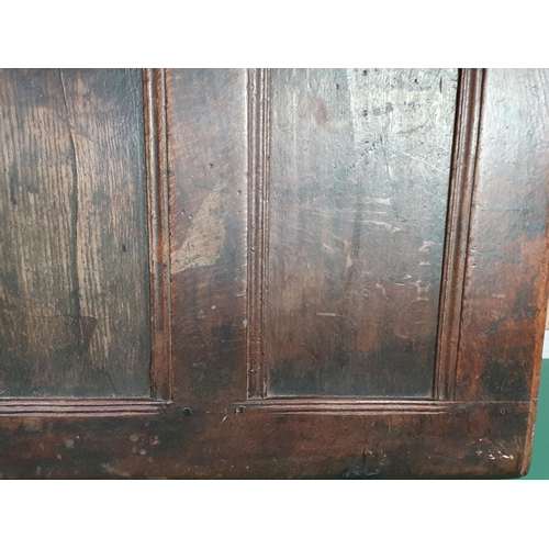 55 - A 17th century oak Coffer with four panel lid and plain three panel front, 4ft