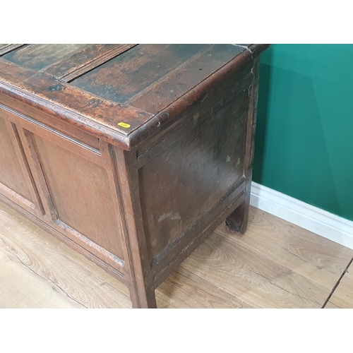 55 - A 17th century oak Coffer with four panel lid and plain three panel front, 4ft