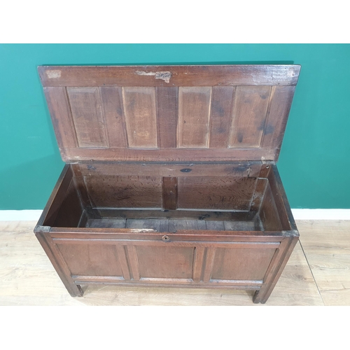 55 - A 17th century oak Coffer with four panel lid and plain three panel front, 4ft