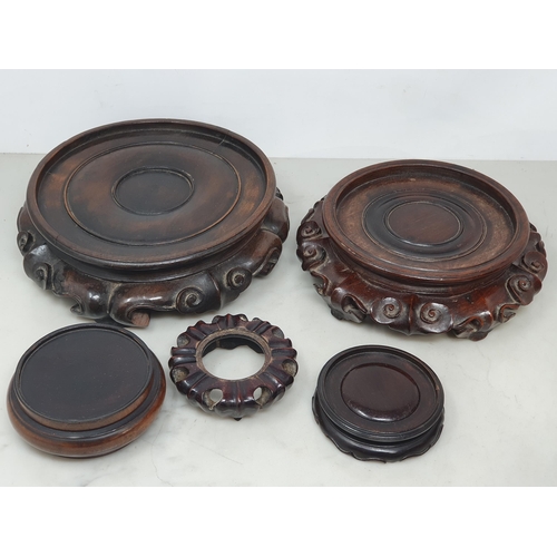 550 - A collection of twelve assorted hardwood Chinese Pot Stands some with pierced decorations and shaped... 