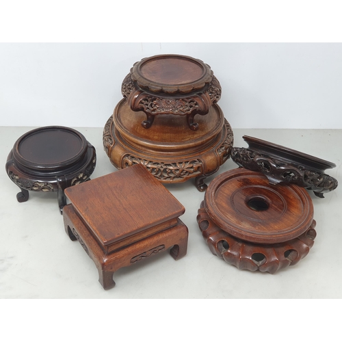 550 - A collection of twelve assorted hardwood Chinese Pot Stands some with pierced decorations and shaped... 