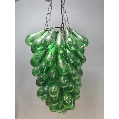 551 - A Ceiling Light Shade decorated with green glass baubles suspended from a wire frame 12in L (R6)