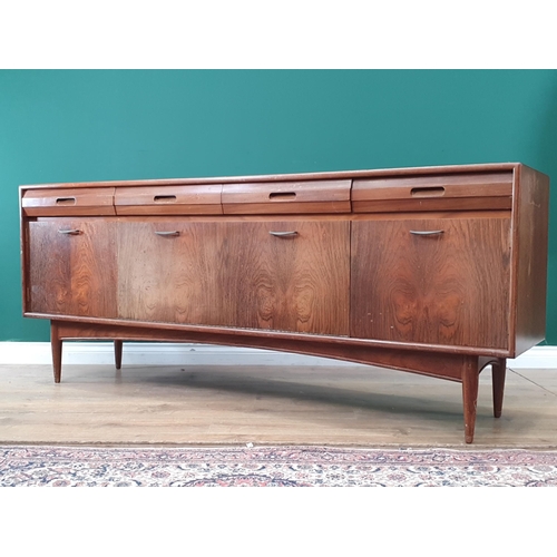 620 - A mid-Century teak Sideboard fitted four frieze drawers above four cupboard doors 6ft 1in W x 2ft 6i... 