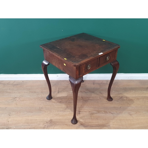 626 - A mahogany Side Table with leather inset top fitted two frieze drawers raised on cabriole supports a... 