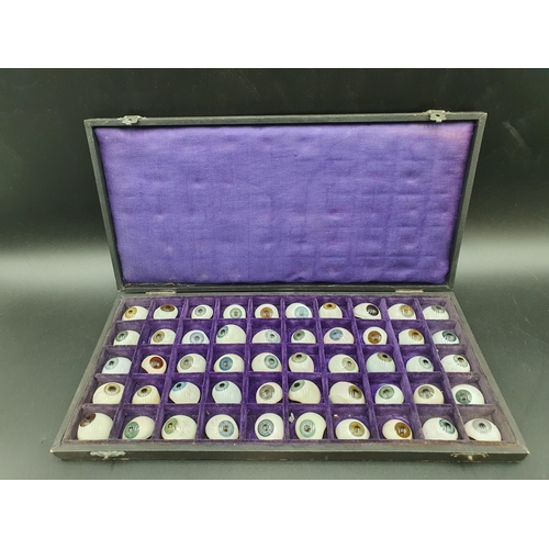 65 - A Case containing fifty glass Artificial Eyes, together with trade label for Hermann Hellbach, Lausc... 