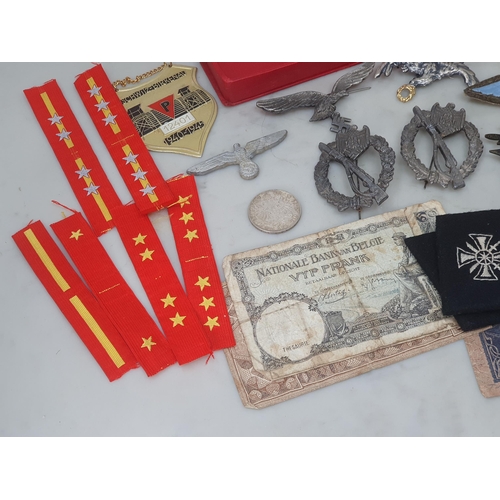 67 - A collection of Polish, German and Japanese Military Badges and other effects including Police Airfo... 