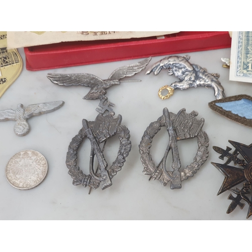 67 - A collection of Polish, German and Japanese Military Badges and other effects including Police Airfo... 