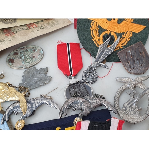 67 - A collection of Polish, German and Japanese Military Badges and other effects including Police Airfo... 