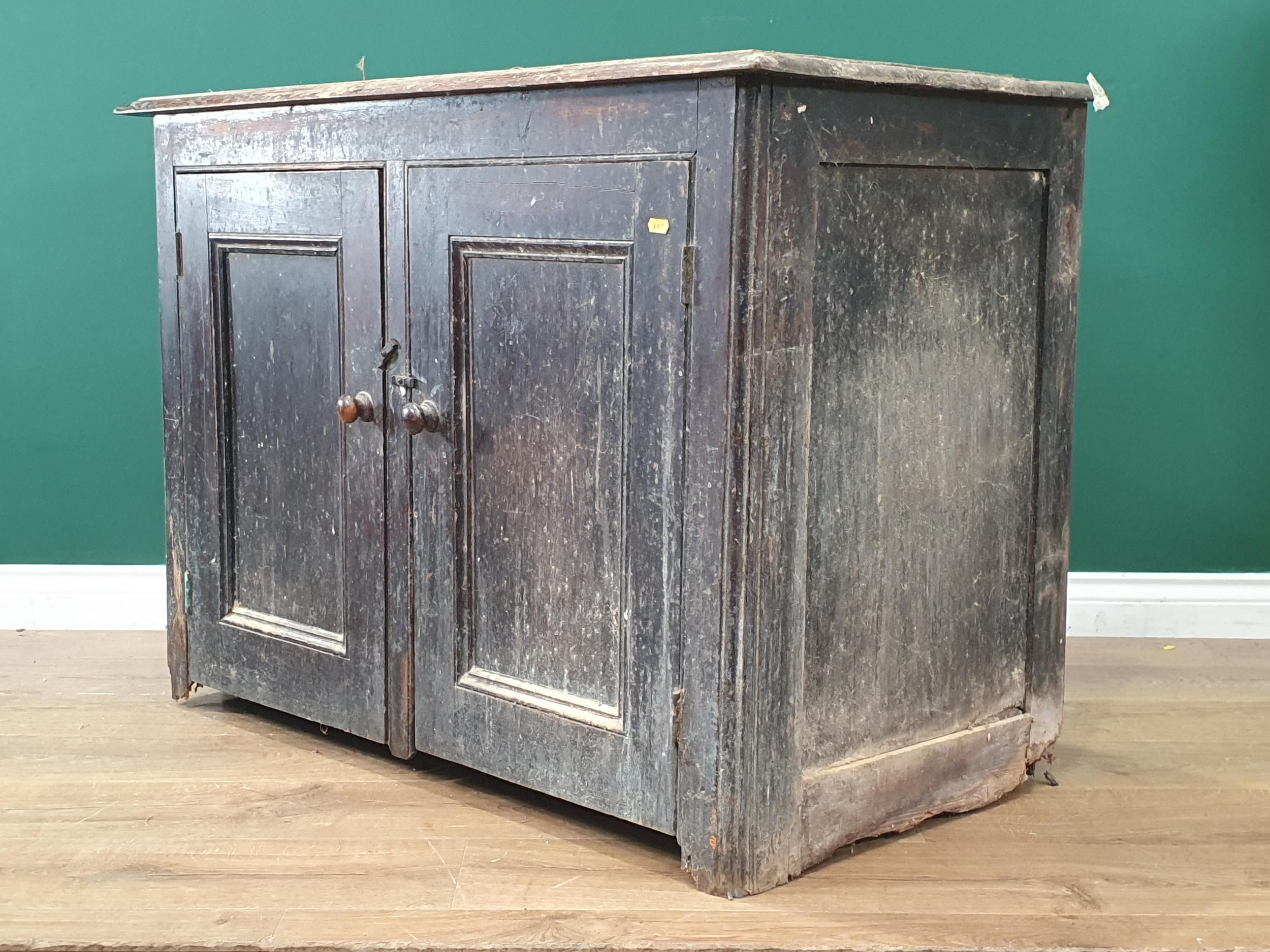 A Victorian scrub top black painted Cupboard fitted pair of panelled ...