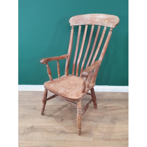 688 - A Windsor style lathe back Elbow Chair on turned supports and H stretcher. (R9).