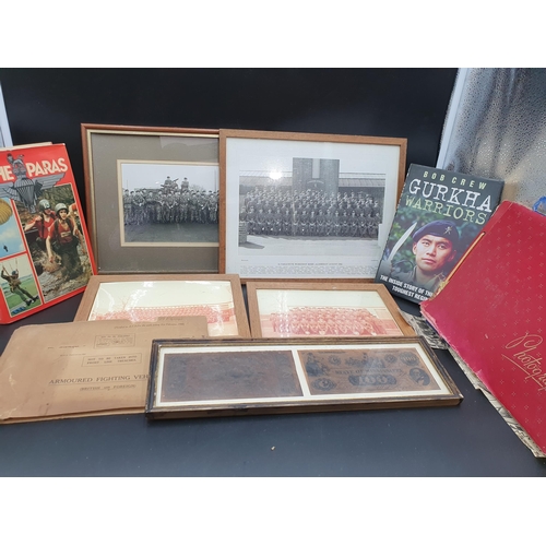 73 - A box of Military Related Items including figures ,books, mug, pictures, photographs, shields, etc (... 