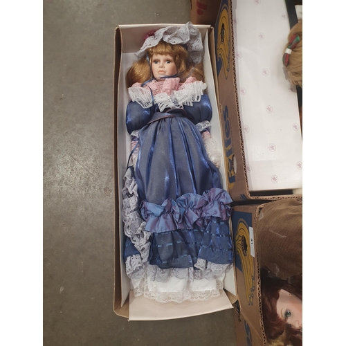 81 - Three boxes of assorted Dolls including, a boxed Tuscany Porcelain Doll, a Leonardo Collection Boxed... 